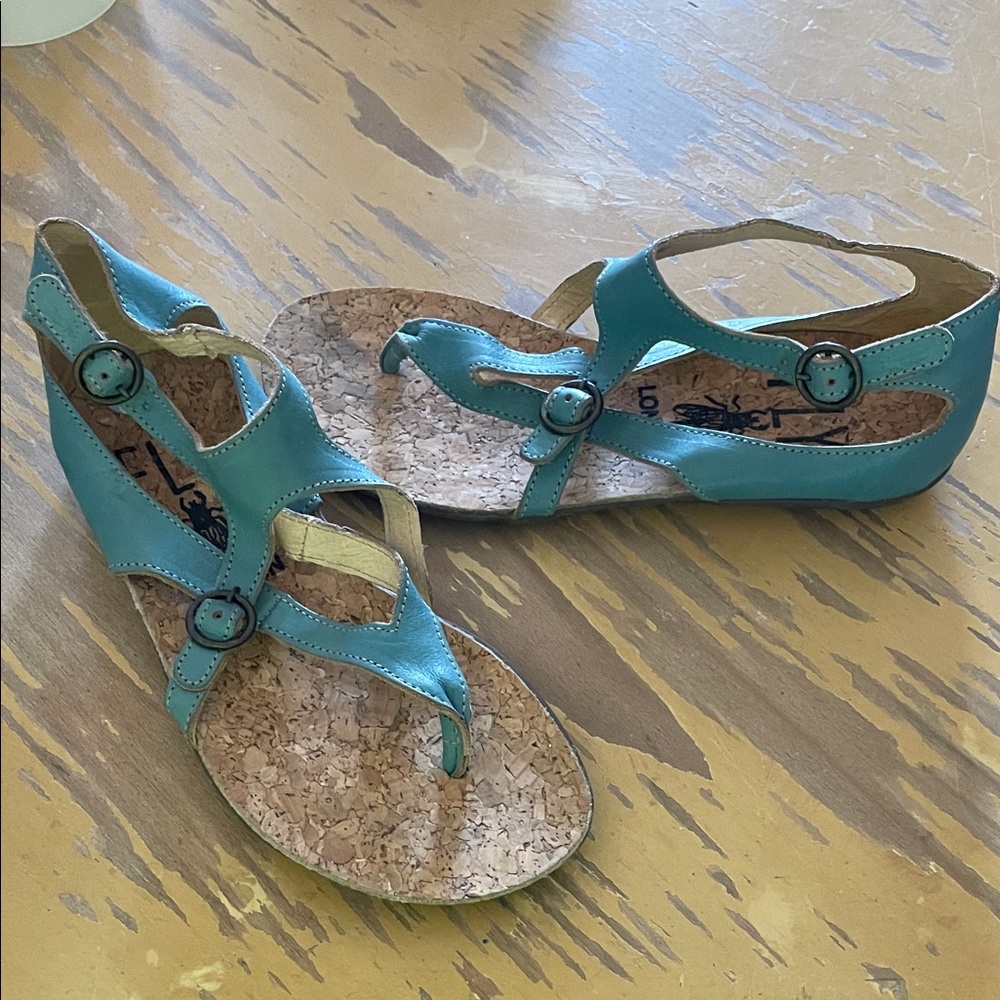 Fly London Women's teal leather double buckle thong Sandals